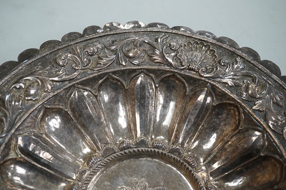 A 19th Century Indian white metal repousse dish, with cusped border, diameter 26.1cm, 14.1oz.